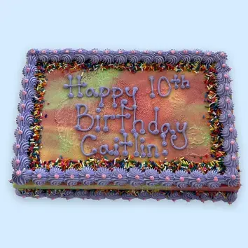 Rainbow Sherbet sheet cake decorated with a birthday message